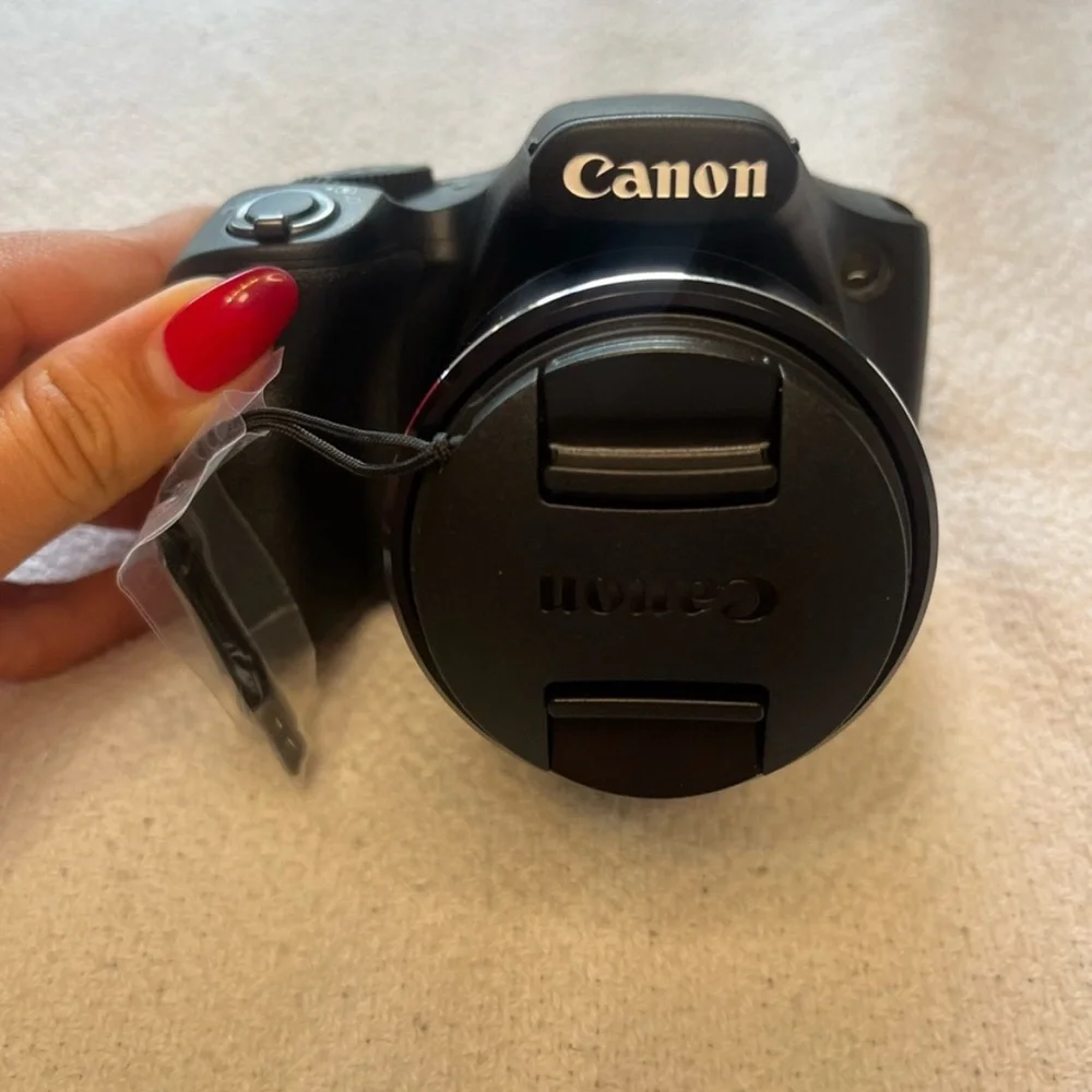 Canon Black Digital Camera with Large Zoom Lens and Textured Grip